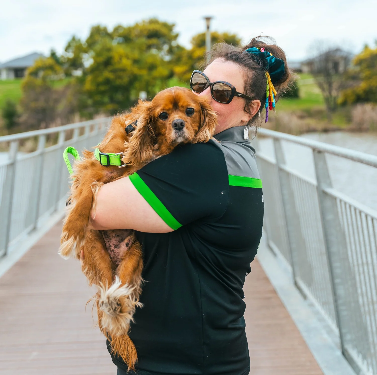 A Pawsome team member cuddling a dog during pet minding